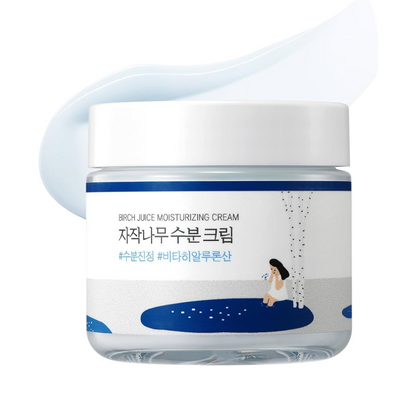 A jar of Birch Juice Moisturizing Cream with a white lid and a white label featuring blue accents and Korean text, shown on a clean white background with a light blue cream smear behind it.