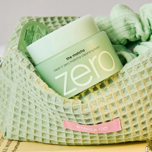 Green skincare product with 'zero' branding on a textured green surface
