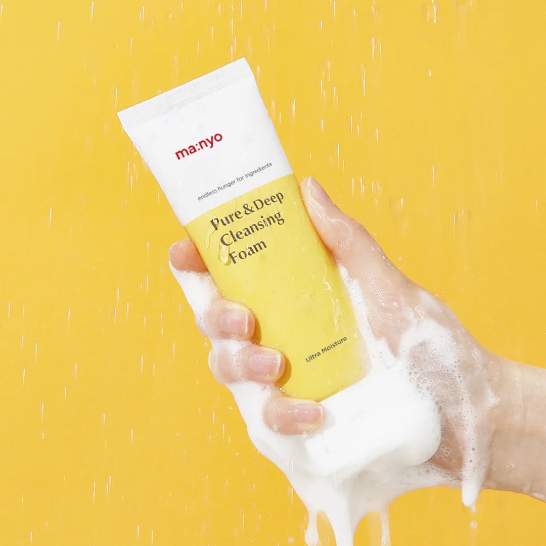 ma:nyo Pure&Deep Cleansing Foam 200ml held in hand, showcasing rich foam and clean packaging.