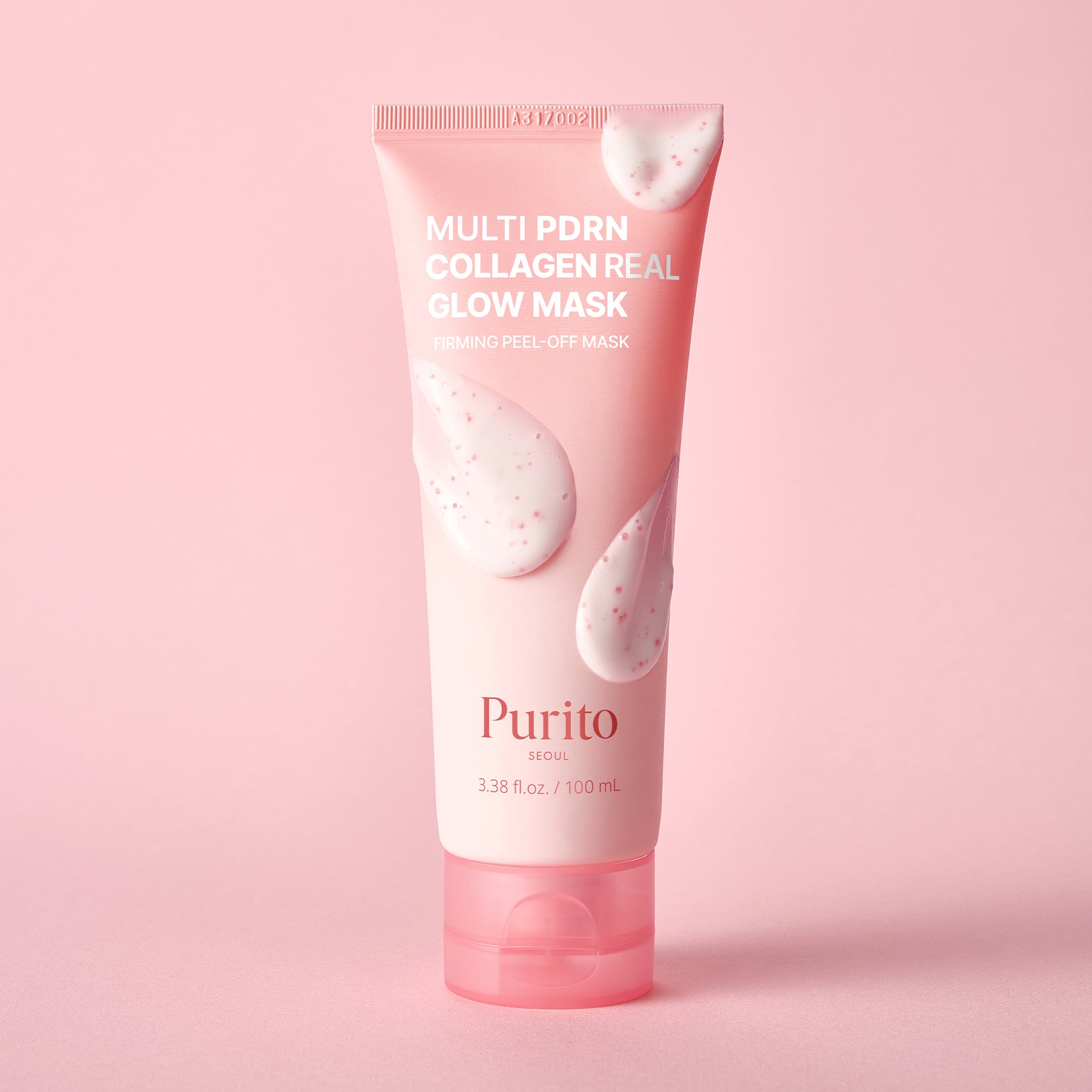 A pink squeeze tube of Purito Multi PDRN Collagen Real Glow Mask, featuring white text and droplet graphics, set against a solid pink background.