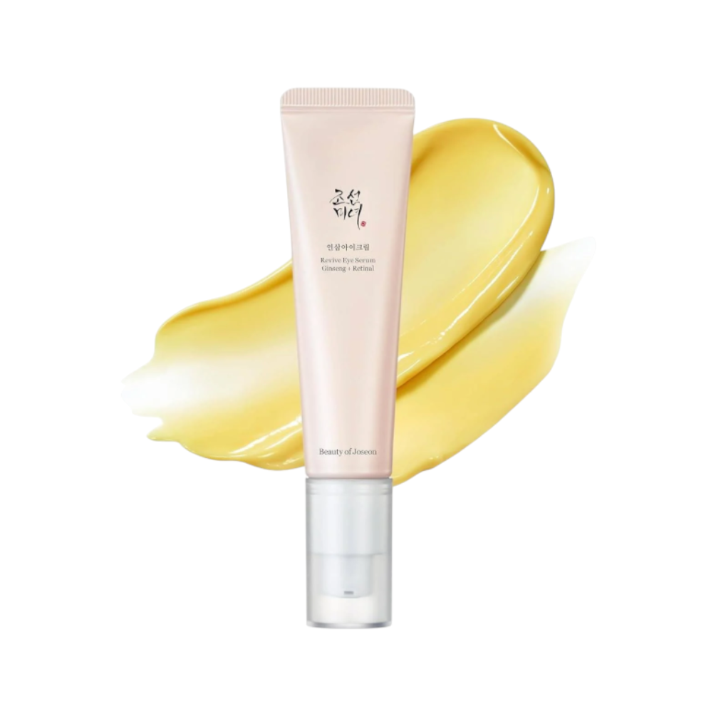 Beauty of Joseon Rose Eye Serum in a pale pink squeeze tube with a clear cap, shown in front of a yellow cream smear on a white background.