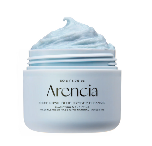 A jar of Arencia Fresh Royal Blue Hyssop Cleanser with a light blue whipped cleanser visible in an open container, set against a plain white background.