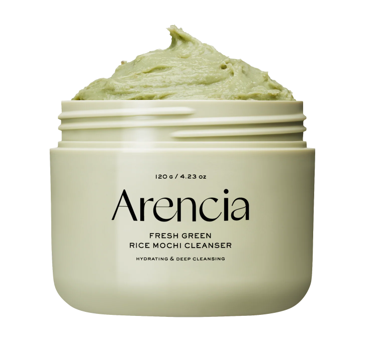 An open jar of Arencia Fresh Green Rice Mochi Cleanser, showing the light green cream inside, on a solid white background.