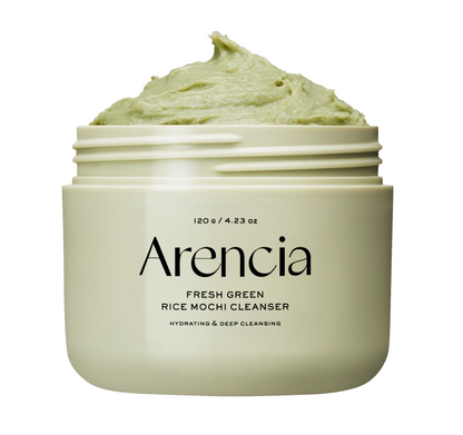 An open jar of Arencia Fresh Green Rice Mochi Cleanser, showing the light green cream inside, on a solid white background.