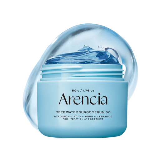 A jar of Arencia Deep Water Surge Serum 30 in a light blue container with a matching blue liquid splash graphic behind it, on a plain white background.