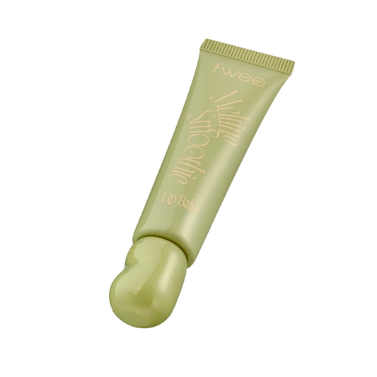 A single tube of fwee lip balm in a light olive green color, floating against a light gray background with black bars on the sides.