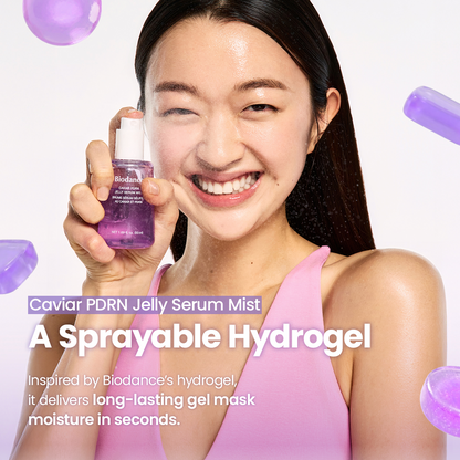 A smiling woman in a pink top holds up a purple bottle of Biodance Caviar PDRN Jelly Serum Mist against a white background with floating purple gel spheres and promotional text.