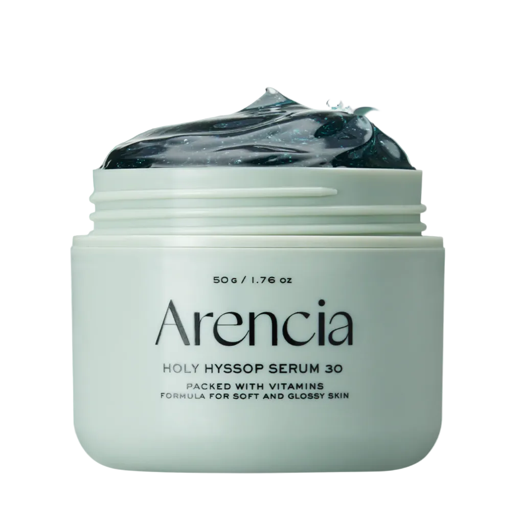 A jar of Arencia Holy Hyssop Serum 30 with a pale mint-green container, dark gel visible at the top, and a translucent mint-green splash behind it on a white background.