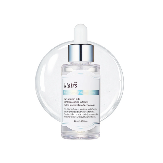 A clear glass dropper bottle of klairs Vitamin C + B5 Cellulose Enrichment Serum with a silver cap and white dropper, set against a white background with a subtle circular reflection.