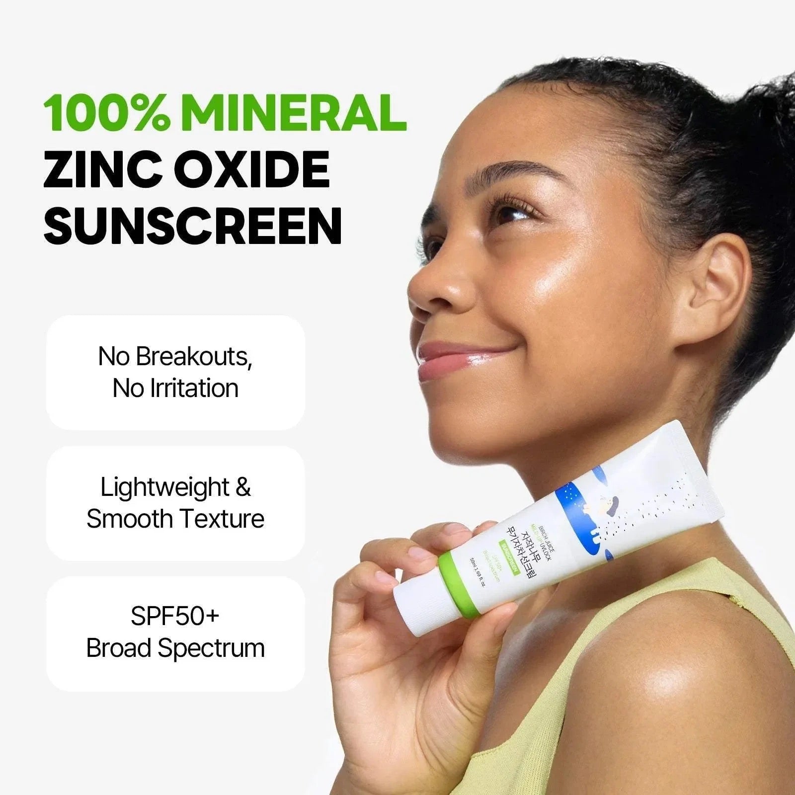 Woman holding a tube of 100% mineral zinc oxide sunscreen with product features listed.